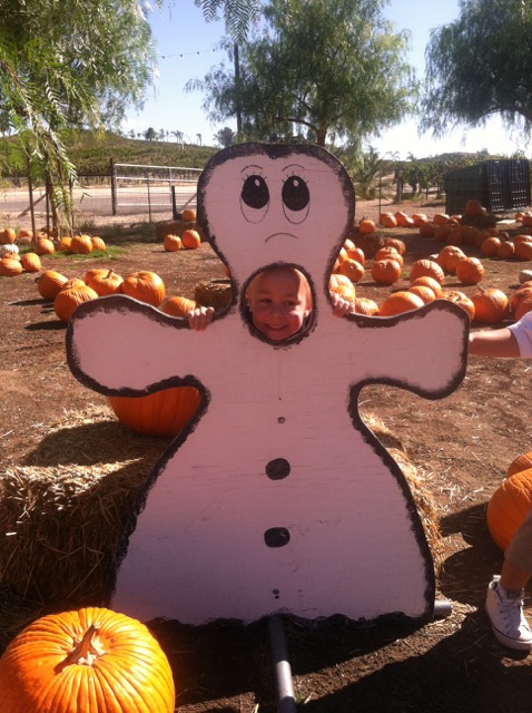 A photo of Hiatt posing behind a ghost prop